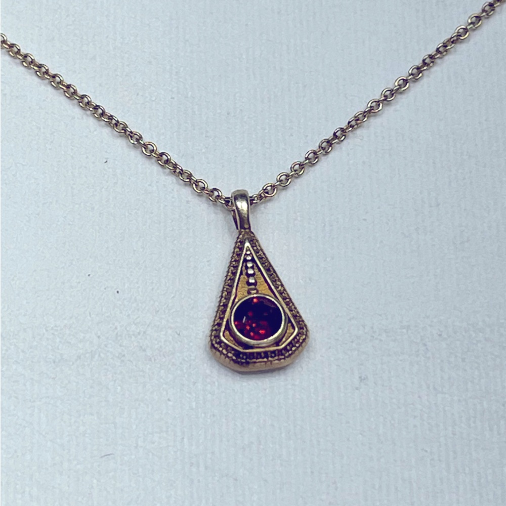 Gold vermeil necklace and pendant with garnet inset.